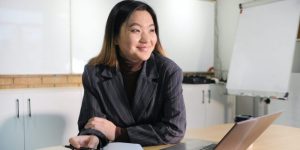 Woman working desk smiling