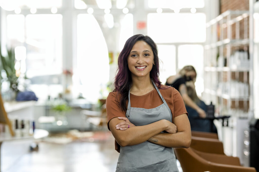 Smiling small beauty salon owner